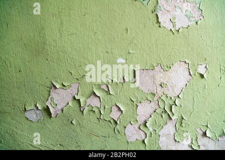 Close up of old stucco cracks on the wall. Weathered paint cracks on plaster. Cracked wall background. Abstract Web Banner Stock Photo