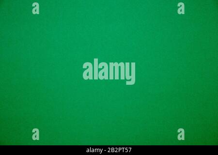 Bright green background.Red cardboard texture Stock Photo