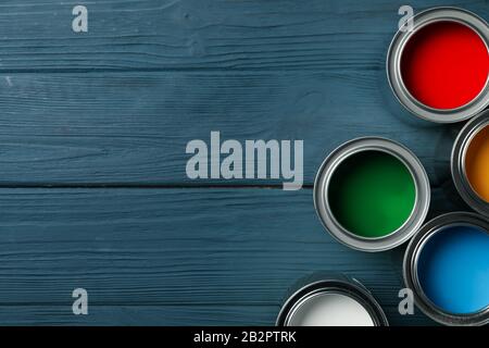 Paint cans on wooden background, space for text Stock Photo