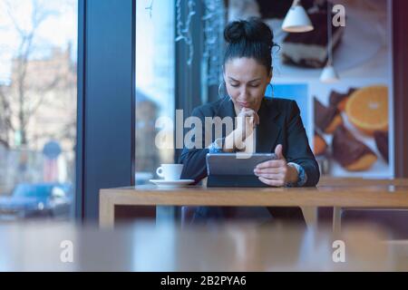 Startup Diversity Brainstorming  Concept.Pretty young Business woman celebrating for succes while reading results of  Economy Report Document Laptop.D Stock Photo