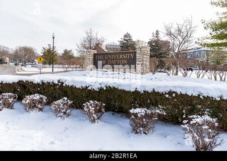 Dayton, OH, USA / February 28, 2020: University of Dayton sign, with fresh winter snow on the ground. Stock Photo