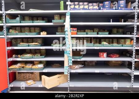London, UK. 3rd Mar, 2020. Photo taken on March 3, 2020 shows the almost-empty shelves of pasta at a supermarket in London, Britain. British Prime Minister Boris Johnson on Tuesday set out the government's action plan to tackle the spread of the novel coronavirus, as the number of infections reached 51 across the country. Credit: Xinhua/Alamy Live News Stock Photo