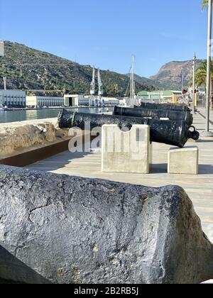 CARTAGENA, SPAIN - Oct 16, 2019: Vertical closeup shot of several war cannons near the harbour in Cartagena, Murcia. Stock Photo