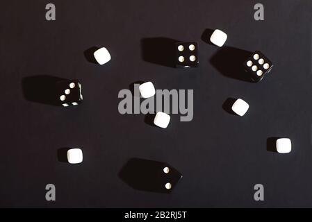 The dice are scattered on a black cloth. Concept. Stock Photo