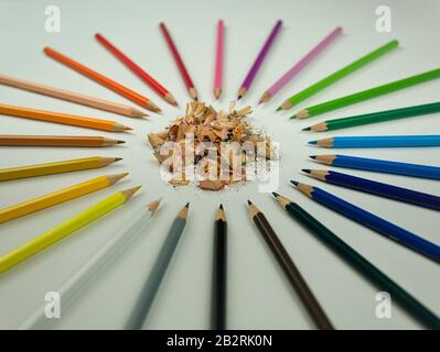 A circle of sharpened crayons in different colours Stock Photo