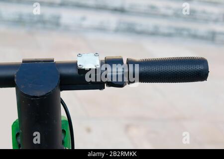 Close up on electric scooter handlebar outdoor Stock Photo