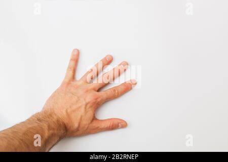 close up man hand placed on white background with palm opened Stock Photo