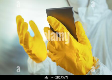 Epidemiologist using smartphone in hospital virus infection quarantine, selective focus Stock Photo