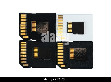 conceptual photo of sd flash memory cards and micro SD lying on top of each other, isolate on a white background. Stock Photo