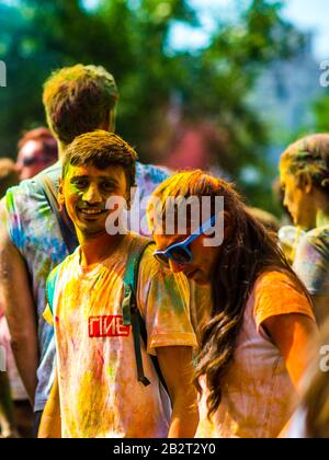 Montreal,Canada - Auguest 10 2019: People celebrate HOLI Festival throwing color powders in Horloge Park in Montreal Stock Photo