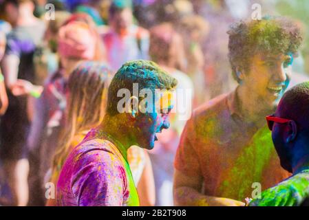 Montreal,Canada - Auguest 10 2019: People celebrate HOLI Festival throwing color powders in Horloge Park in Montreal Stock Photo