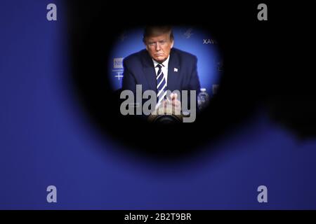 Bethesda, United States. 03rd Mar, 2020. President Donald Trump, seen through a video camera's eyepiece, attends a coronavirus roundtable briefing at the National Institutes of Health (NIH), Tuesday, March 3, 2020, in Bethesda, MD. Trumps visit comes as the Coronavirus death toll in the U.S. has risen to nine with more than 100 cases in 15 states. Photo by Yuri Gripas/UPI Credit: UPI/Alamy Live News Stock Photo