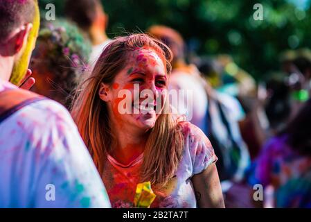 Montreal,Canada - Auguest 10 2019: People celebrate HOLI Festival throwing color powders in Horloge Park in Montreal Stock Photo