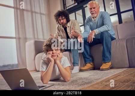 Father get angry and scold his son because he is internet addicted Stock Photo