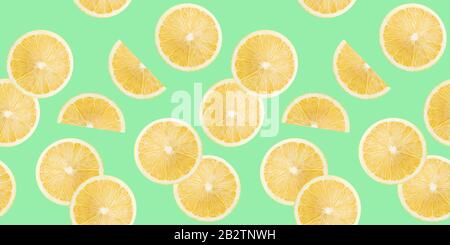pattern with lemon slices on a light green background. Stock Photo