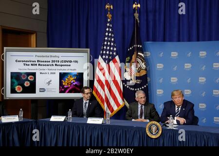 United States President Donald J. Trump participates in a coronavirus roundtable briefing at National Institutes of Health's Vaccine Research Center in Bethesda, Maryland on March 3, 2020. From left to right: Dr. John Mascola, Director, Vaccine Research Center, NIH; Director of the National Institute of Allergy and Infectious Diseases at the National Institutes of Health Dr. Anthony Fauci; and the President.Credit: Yuri Gripas/Pool via CNP | usage worldwide Stock Photo