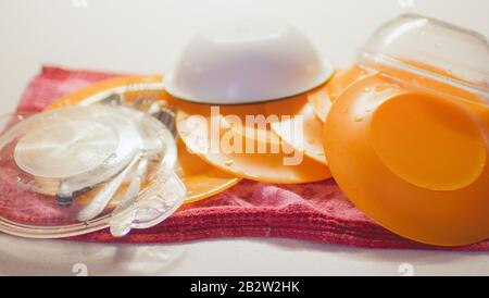 Washed wet dishes on a towel on the table Stock Photo