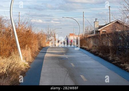 Chicago, IL/USA - Along the Bloomingdale trail, an elevated walkway once an old railroad line now a greenway welcoming bicyclists and walkers. Stock Photo