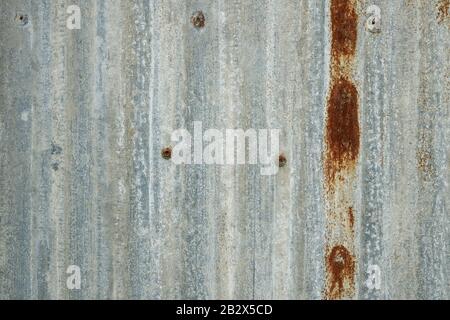 Rusted galvanized iron plate texture metal surface background close up Stock Photo