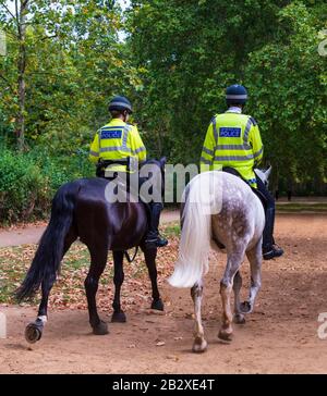 London police patrol the parks on Horseback Stock Photo