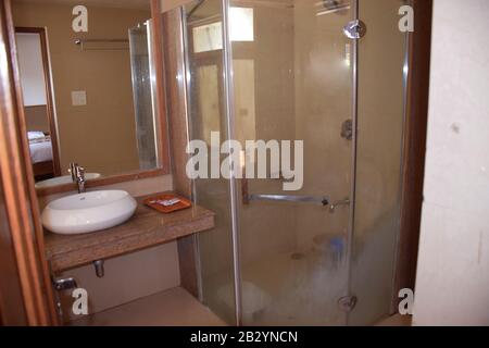 A hotel toilet with washbasin Stock Photo