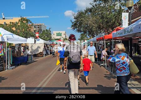 Vendors and shoppers at the Sarasota Farmers Market in fall. This vibrant event occurs downtown on Lemon Avenue Stock Photo