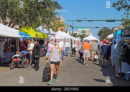 Vendors and shoppers at the Sarasota Farmers Market in fall. This vibrant event occurs downtown on Lemon Avenue. Stock Photo