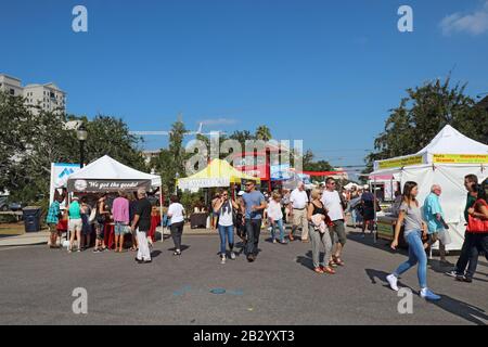 Vendors and shoppers at the Sarasota Farmers Market in fall. This vibrant event occurs downtown on Lemon Avenue. Stock Photo