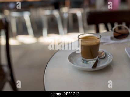 Expresso coffee drink sitting on counter in diner Stock Photo