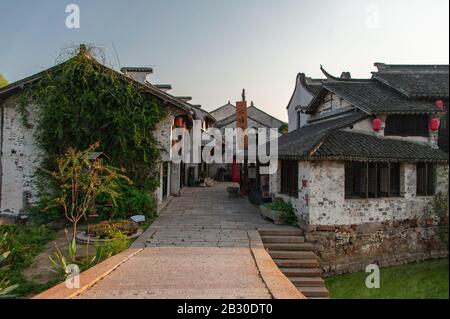 Wuxi, China - October 2019: Ancient Chinese  water village in the Jiangsu Province at sunset. Stock Photo