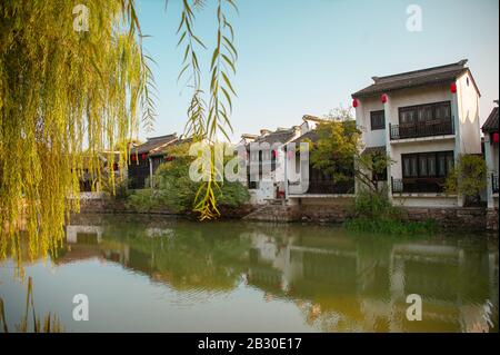 Wuxi, China - October 2019: Ancient Chinese  water village in the Jiangsu Province at sunset. Stock Photo