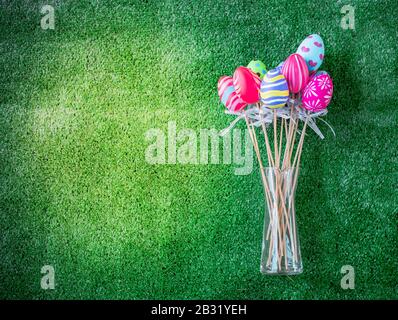 Easter eggs painted decoration with colourful on green grass background Stock Photo