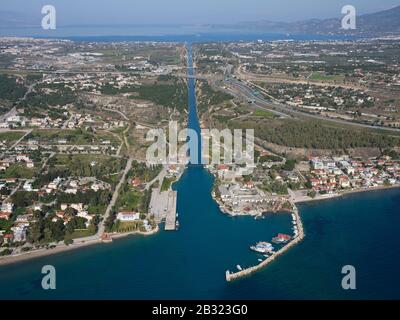 AERIAL VIEW. 6.4km-long Corinth Canal linking the Gulf of Corinth in the distance to the Aegean Sea in the foreground. Isthmus of Corinth, Greece. Stock Photo