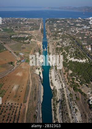 AERIAL VIEW. 6.4km-long Corinth Canal linking the Gulf of Corinth in the distance to the Aegean Sea. Isthmus of Corinth, Greece. Stock Photo