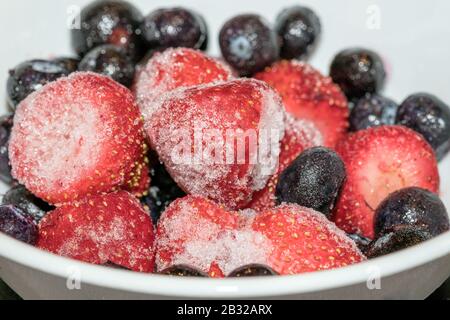 Frozen Berries Mixed in Bowl - Strawberries & Blueberries, Close up Macro Stock Photo