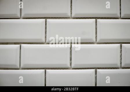 White ceramic bricks on the wall as background. Stock Photo