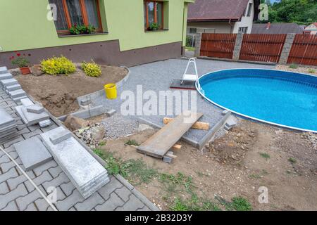 Swimming pool under construction, replacing interlocking pavement in rural country house Stock Photo