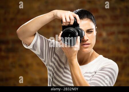 Caucasian female photographer Stock Photo