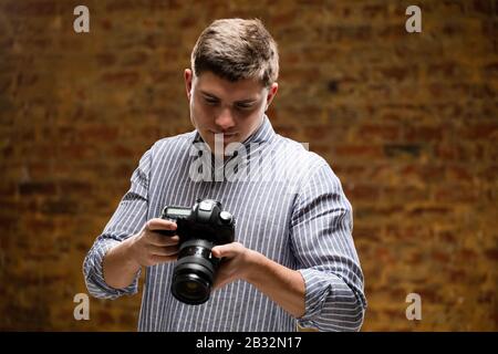 Caucasian male photographer Stock Photo