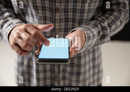 Caucasian woman using a smartphone Stock Photo