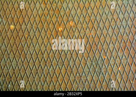 Texture of metal plate with embossed diamond pattern. Rustic iron metal floor with rhombs Stock Photo