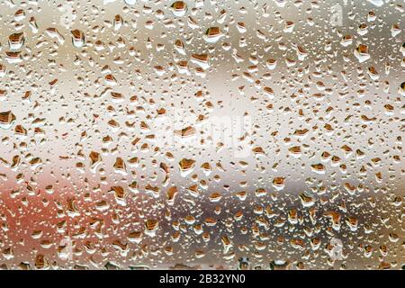 my window covered in raindrops in Marbella, Spain Stock Photo