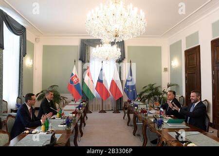 Prague, Czech Republic. 04th Mar, 2020. Slovak Prime Minister Peter Pellegrini, right, Polish PM Mateusz Morawiecki, left, Czech PM Andrej Babis, 2nd from left, and Hungarian PM Viktor Orban, 2nd from right, attend the meeting of the Visegrad Four (V4, comprised of Slovakia, Czech Republic, Hungary and Poland) to discuss coronavirus in Europe, situation in Turkey, migration and EU budget framework, on March 4, 2020, in Prague, Czech Republic. Credit: Ondrej Deml/CTK Photo/Alamy Live News Stock Photo