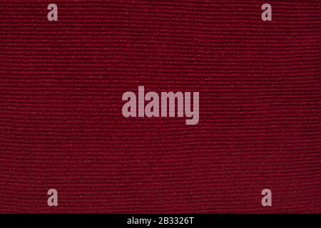 Texture of dark burgundy knitwear with silver thread, textile background. Dark red knitted background Stock Photo