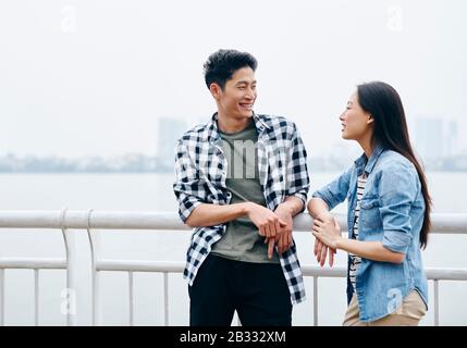 Happy couple having a interesting conversation Stock Photo