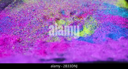 Multi-colored powder sprayed on black background. Stock Photo