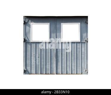 Old gray metal garage gate with blank square windows isolated on white, background photo texture Stock Photo