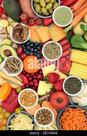 Health food and herbs to ease irritable bowel syndrome. Healthy foods high in antioxidants, protein, dietary fiber, vitamins, minerals & smart carbs. Stock Photo