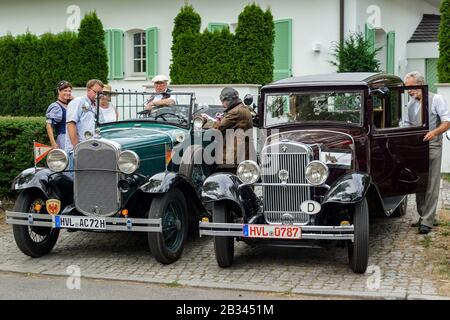 Welfenallee, Berlin, Germany - june 16, 2018: car owners in historical costumes at their Ford and Wanderer cars at the oldtimer meeting in Frohnau Stock Photo