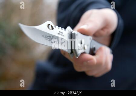 Youth with knife UK. Posed by model Stock Photo